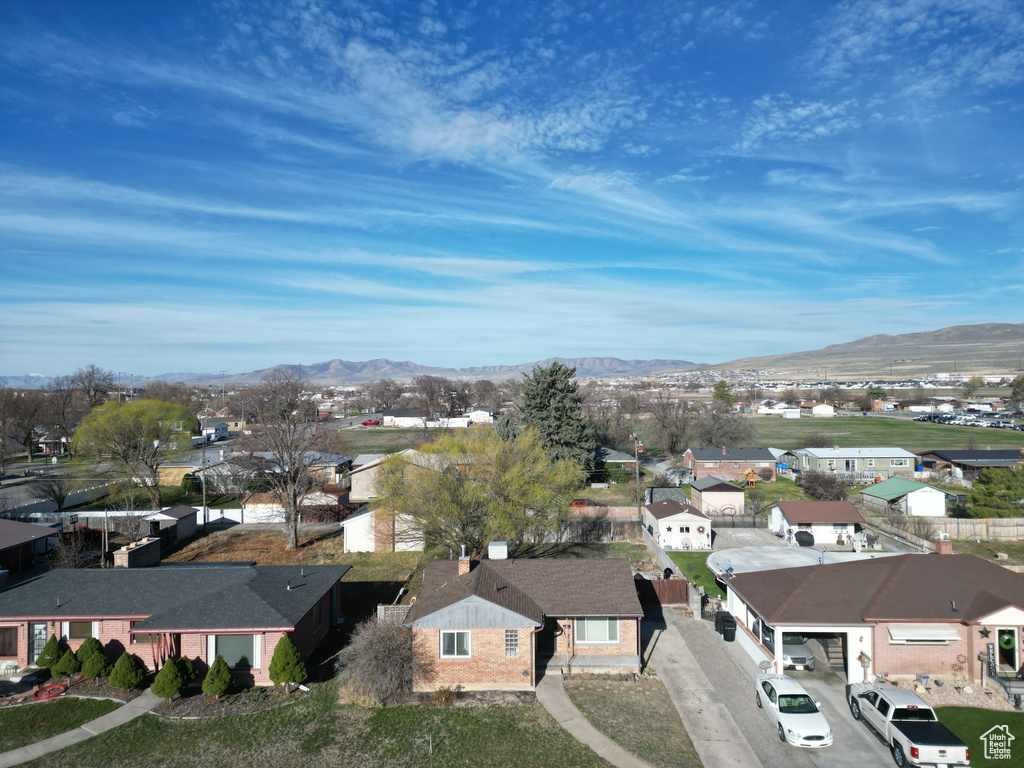 Drone / aerial view with a residential view and a mountain view