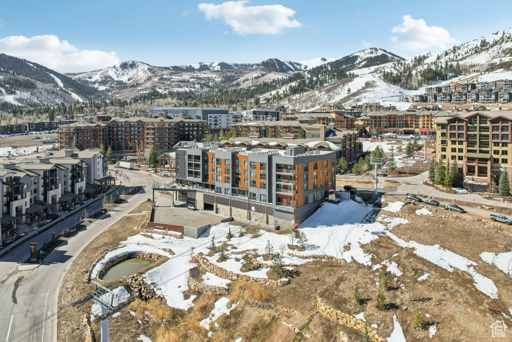 Snowy aerial view featuring a mountain view