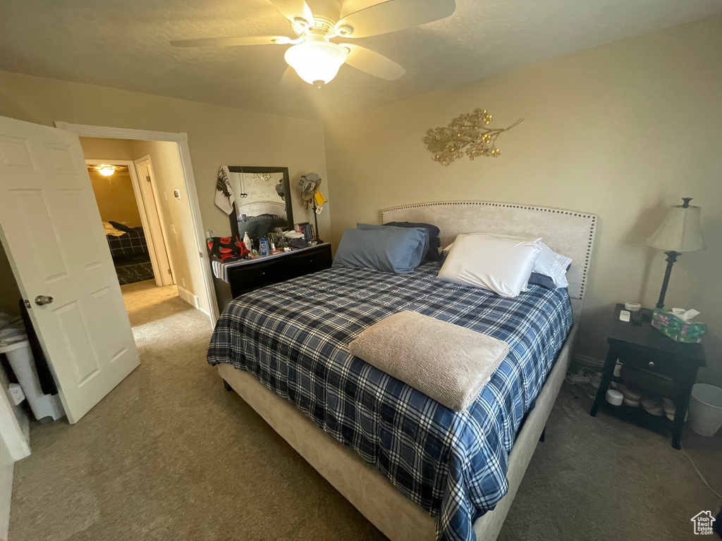 Bedroom featuring carpet floors and ceiling fan