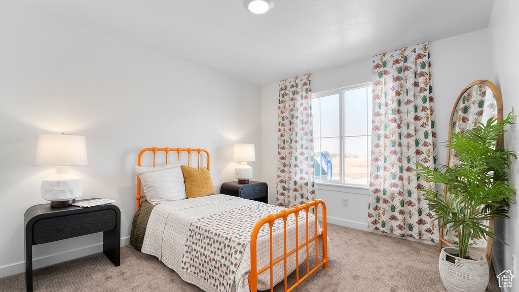 Carpeted bedroom with baseboards