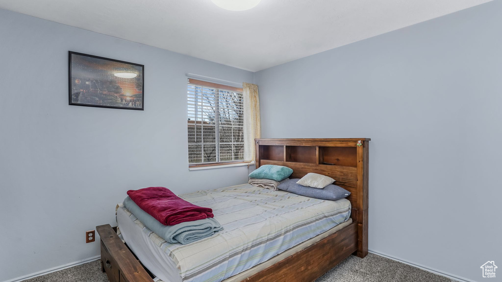 Carpeted bedroom with baseboards