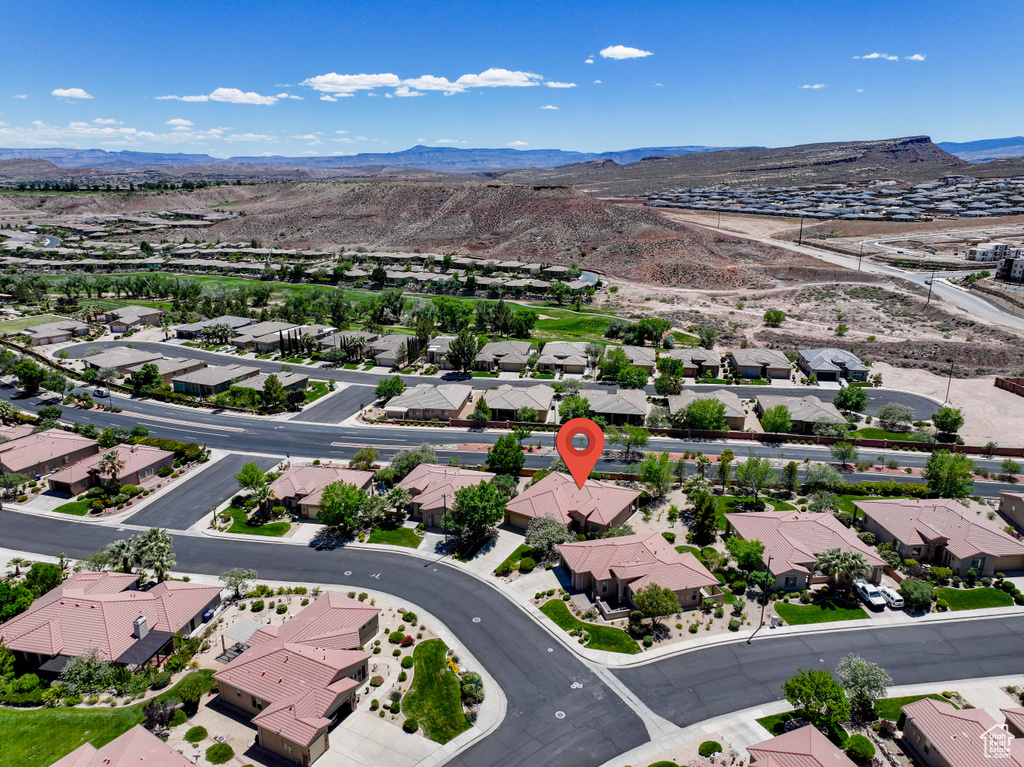 Aerial view of residential area with a mountainous background