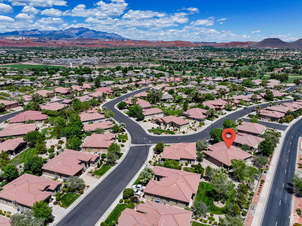 Aerial perspective of suburban area featuring a mountain backdrop