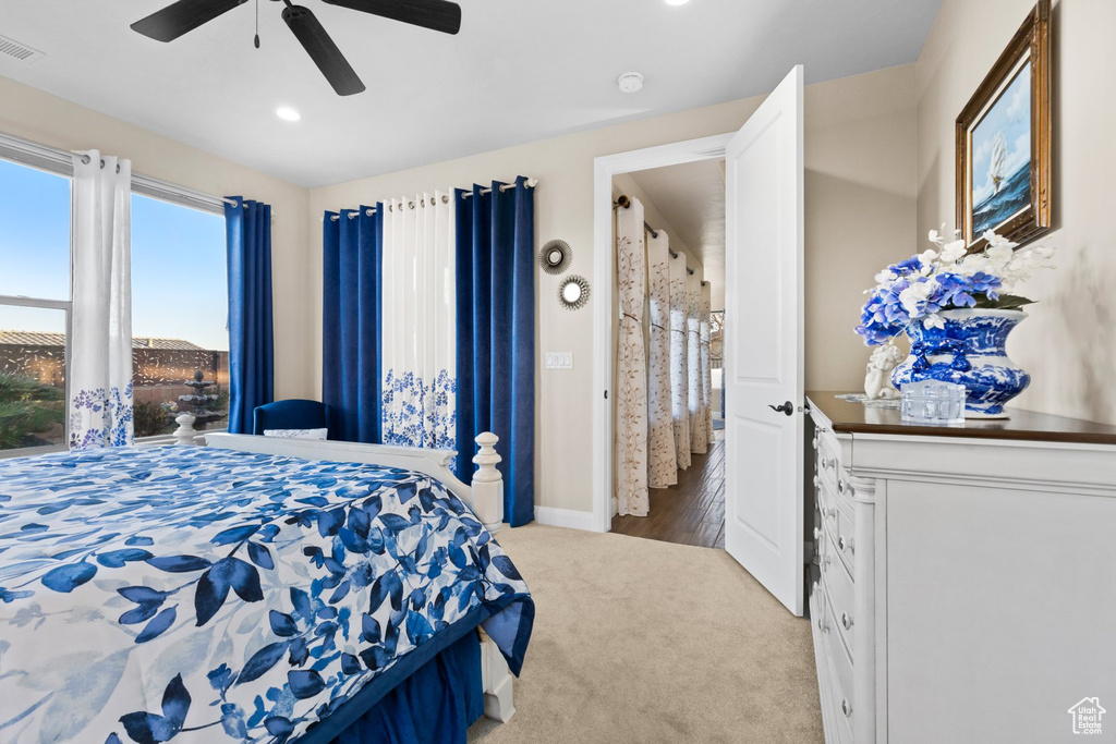 Carpeted bedroom featuring recessed lighting, a ceiling fan, visible vents, and baseboards