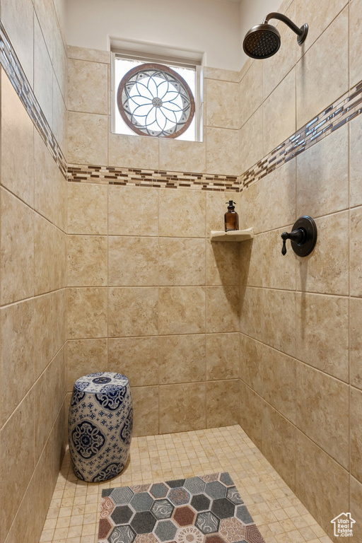 Full bathroom with tiled shower