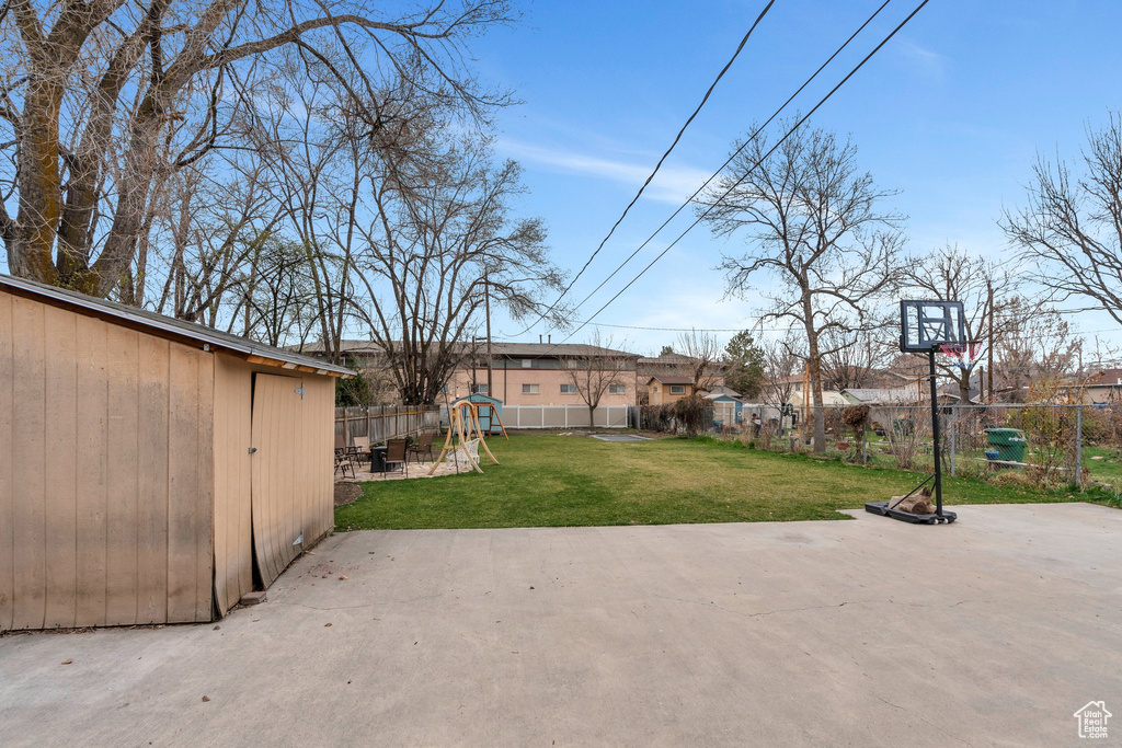 View of patio with fence
