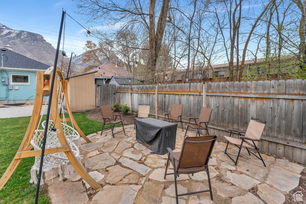 View of patio / terrace featuring an outdoor structure and a fenced backyard