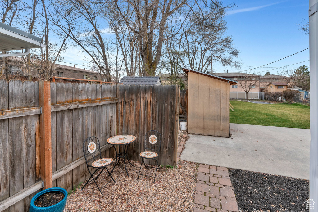View of patio / terrace with an outdoor structure and a fenced backyard