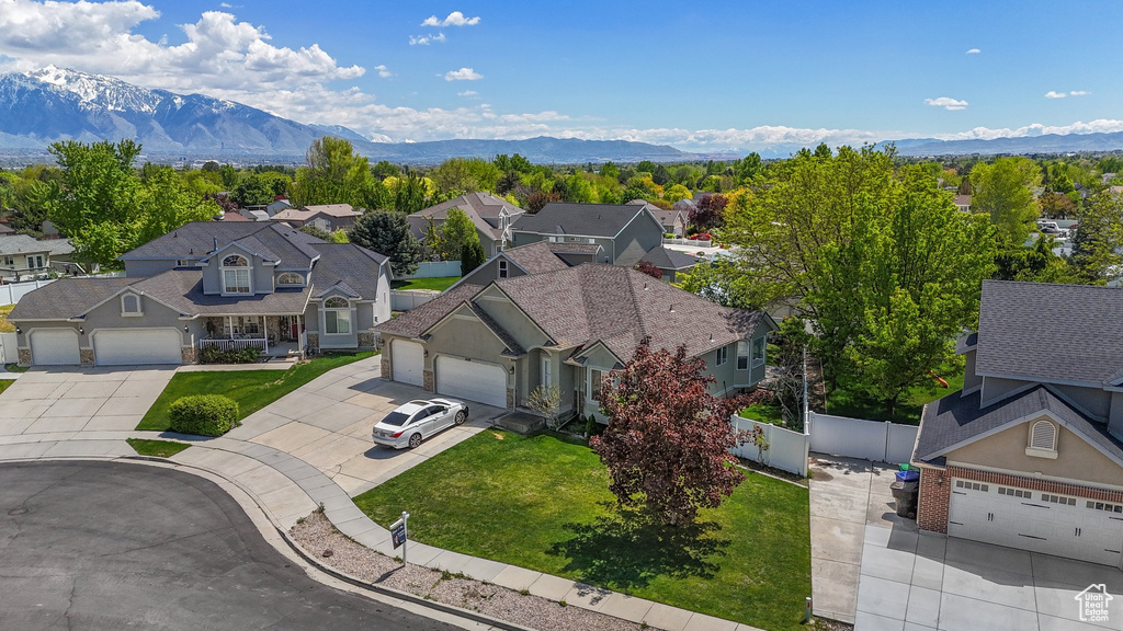 Aerial view of residential area featuring mountains