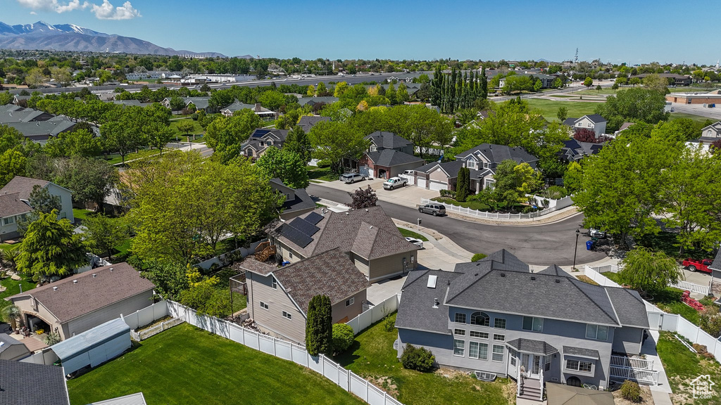 Aerial view of residential area featuring a mountain backdrop