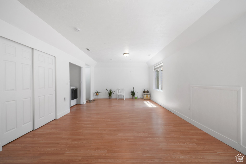 Unfurnished living room with light wood-style floors