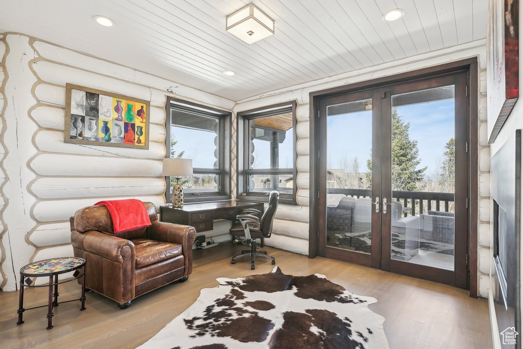 Living area featuring wood finished floors, recessed lighting, french doors, a desk, and wooden ceiling