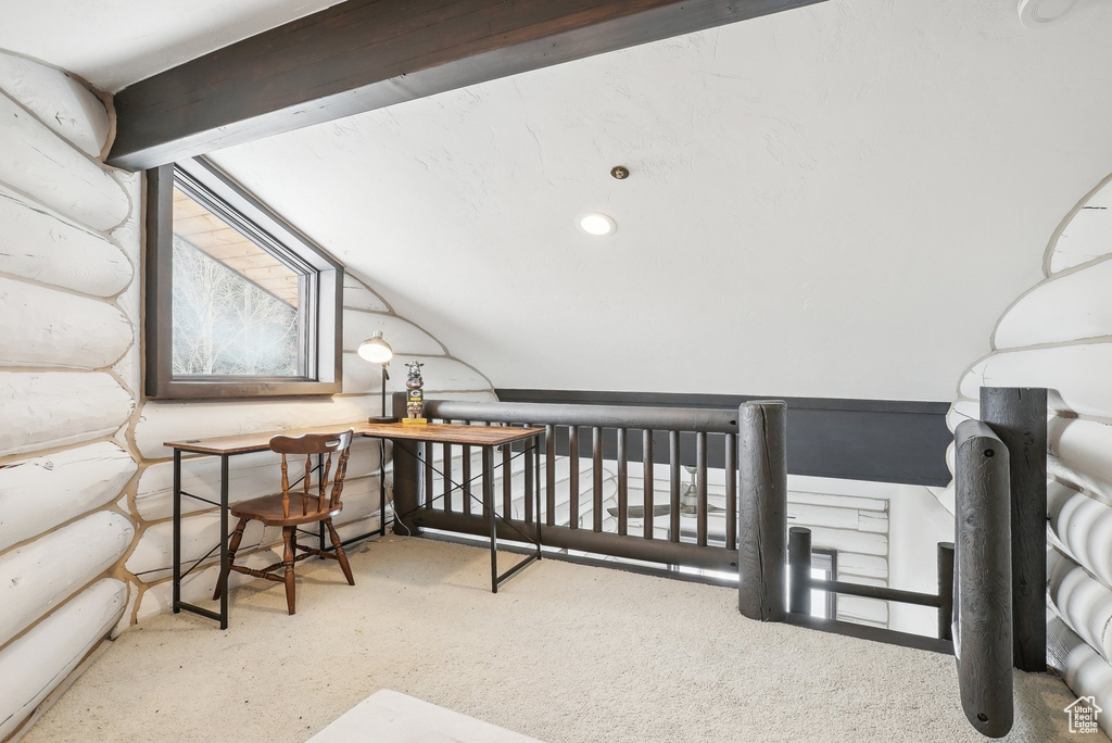 Carpeted bedroom with lofted ceiling