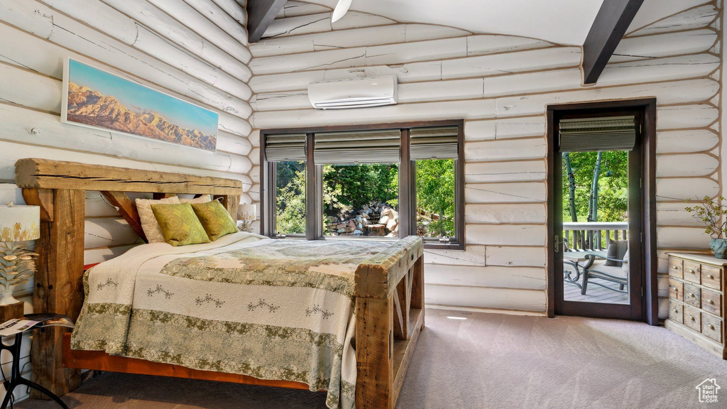 Bedroom featuring log walls, a wall unit AC, carpet flooring, access to outside, and multiple windows