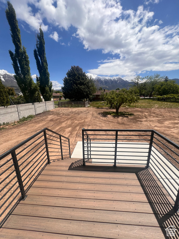 Wooden terrace featuring a mountain view