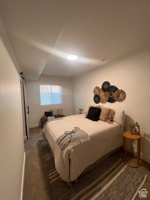 Bedroom with carpet and baseboards