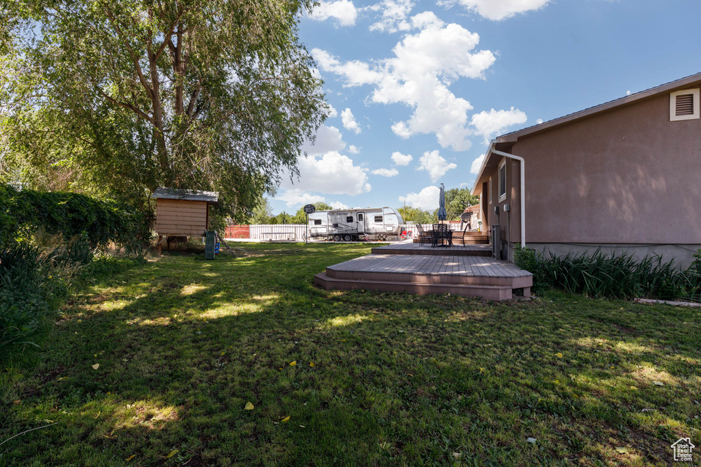 View of yard with a deck