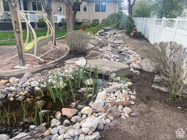 View of yard featuring fence