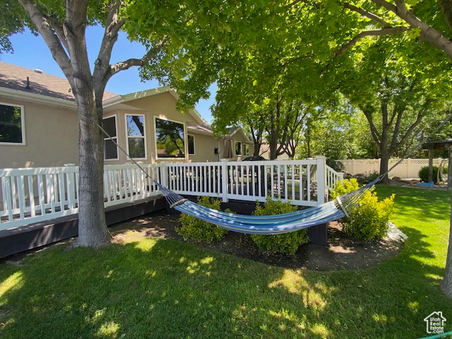 Exterior space with a lawn and fence