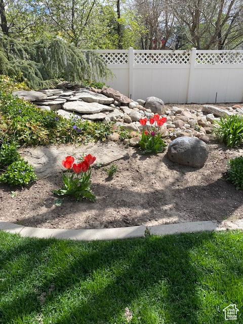 View of yard featuring fence