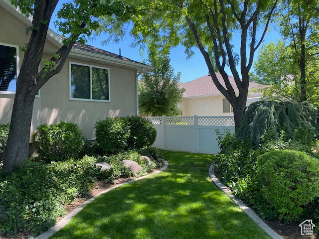 View of yard with fence