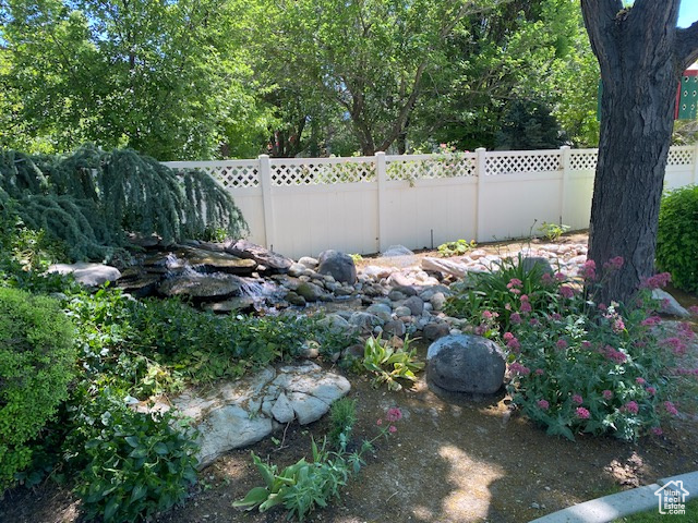 View of yard featuring fence