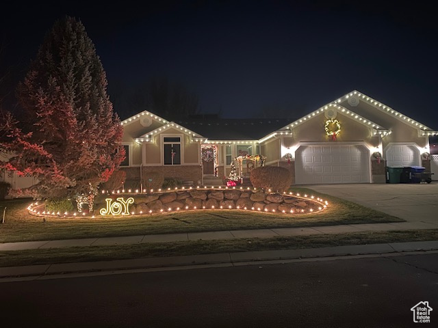 Mediterranean / spanish-style house featuring driveway and an attached garage