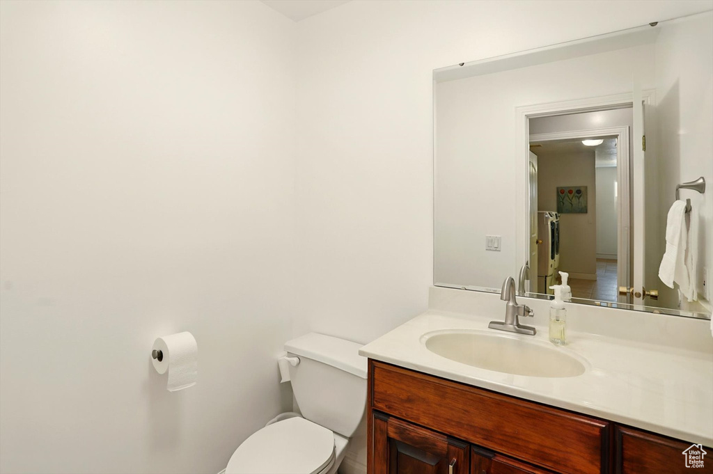 Half bathroom with toilet and vanity