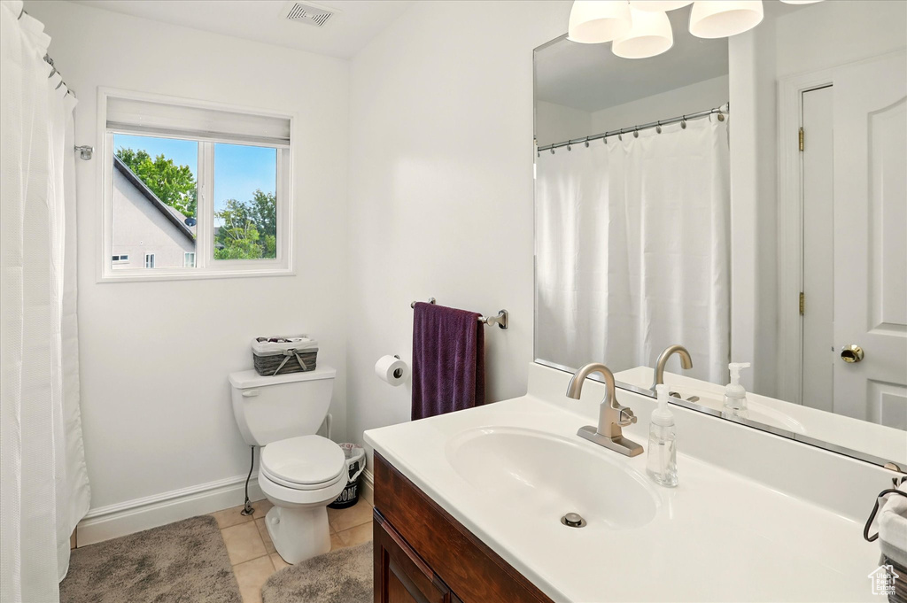 Bathroom with vanity and tile patterned floors