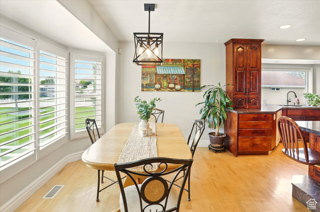 Dining room featuring light wood-style floors and recessed lighting