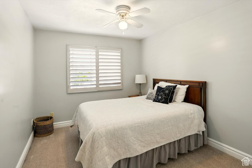 Bedroom with carpet flooring and ceiling fan