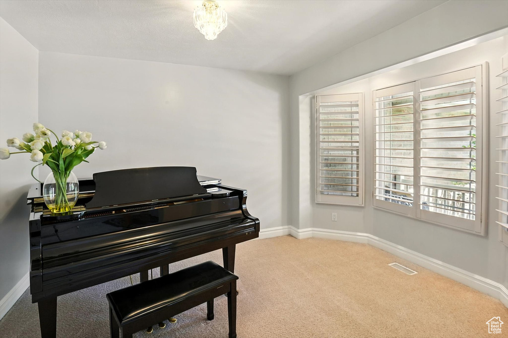 Living area with carpet flooring and healthy amount of natural light