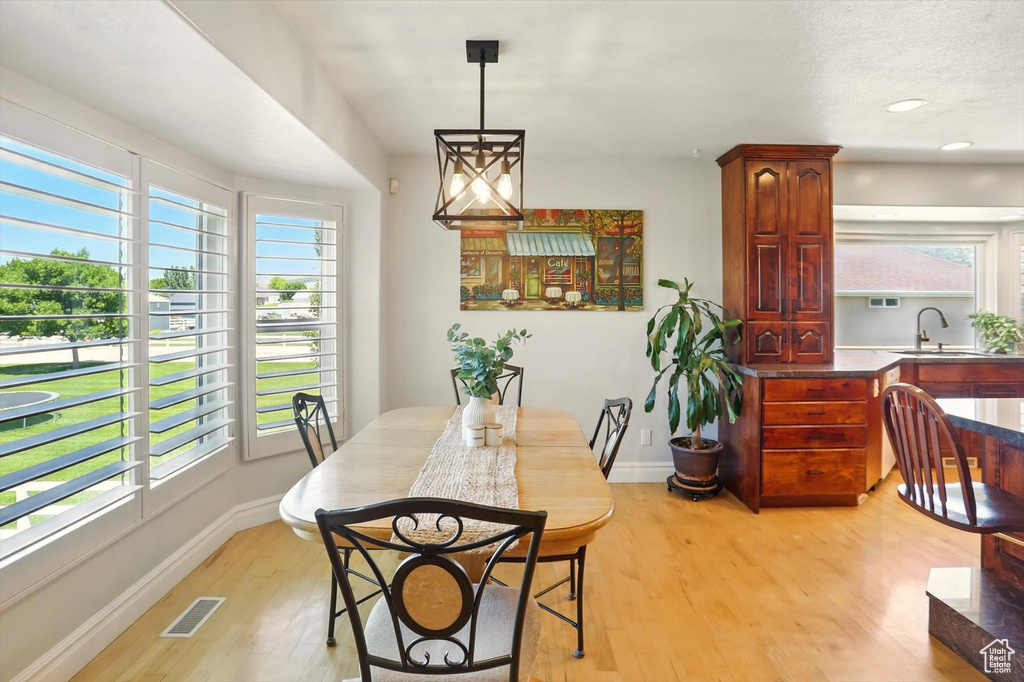 Dining space featuring light wood-type flooring and recessed lighting