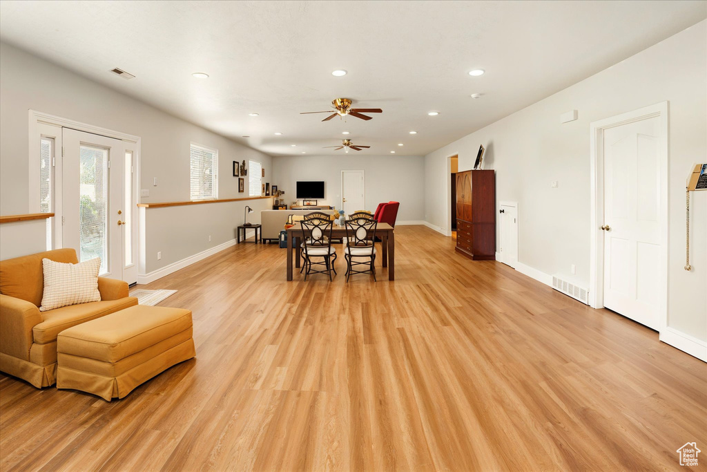 Dining space with ceiling fan, light wood-style flooring, and recessed lighting