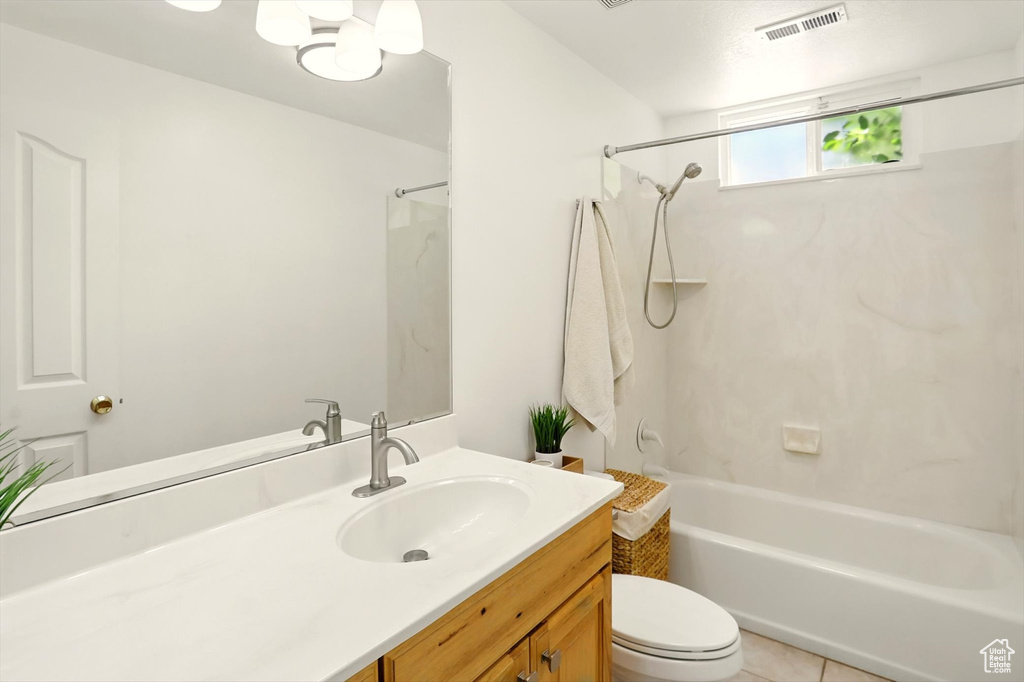 Bathroom with vanity,  shower combination, and tile patterned floors