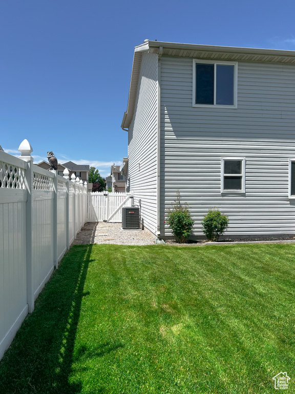 Back of house featuring cooling unit