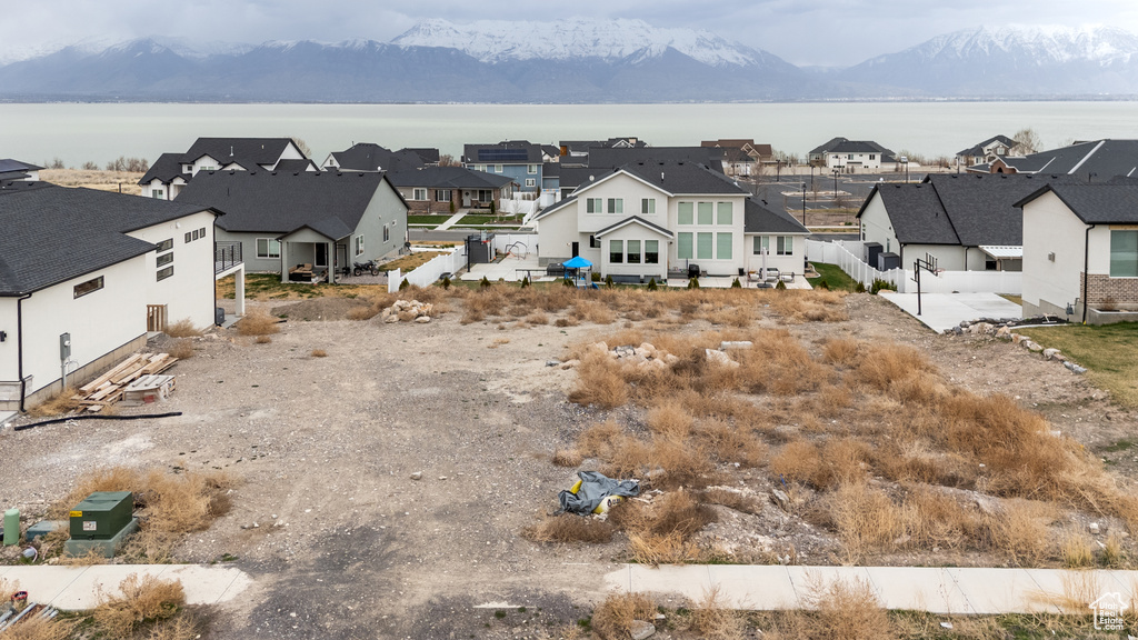 Aerial view of residential area featuring a water and mountain view