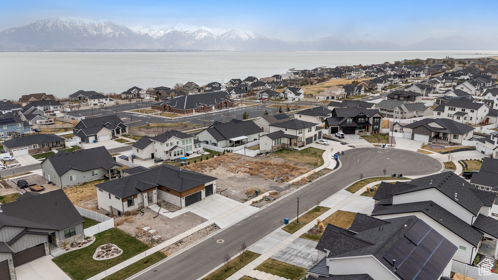 Aerial perspective of suburban area featuring a water and mountain view