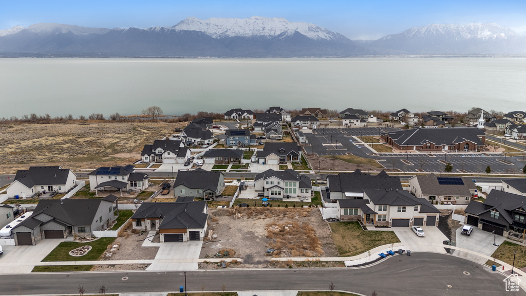 Aerial perspective of suburban area with a water and mountain view