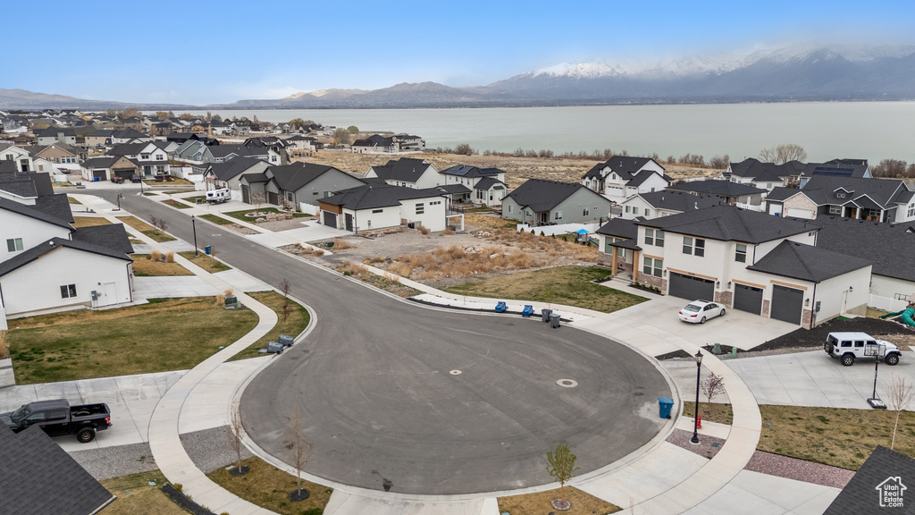 Aerial view of residential area featuring a water and mountain view