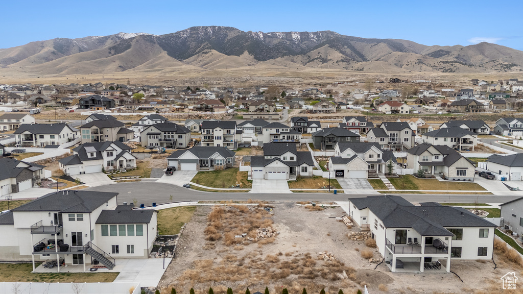 Aerial view of residential area with a mountainous background