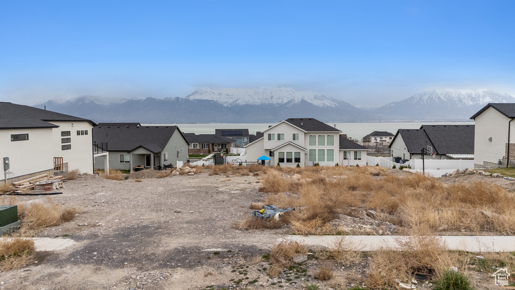 View of yard featuring a residential view and a mountain view