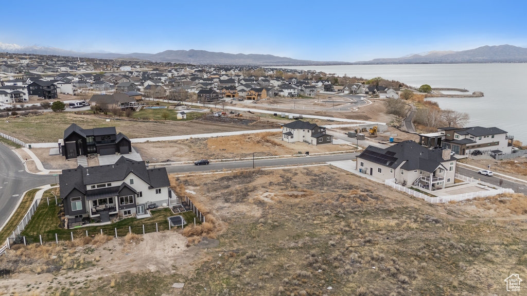 Aerial perspective of suburban area featuring a water and mountain view