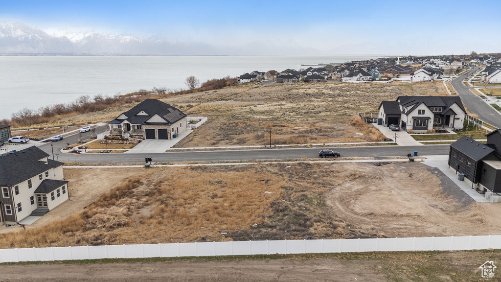 Aerial perspective of suburban area with a nearby body of water