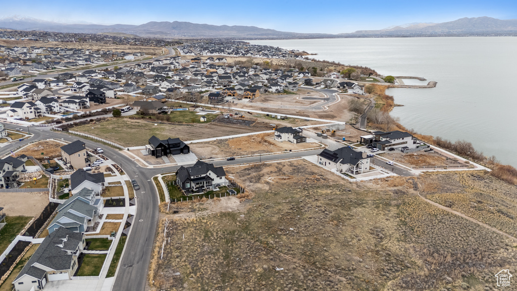 Aerial view of property\'s location with a water and mountain view and nearby suburban area