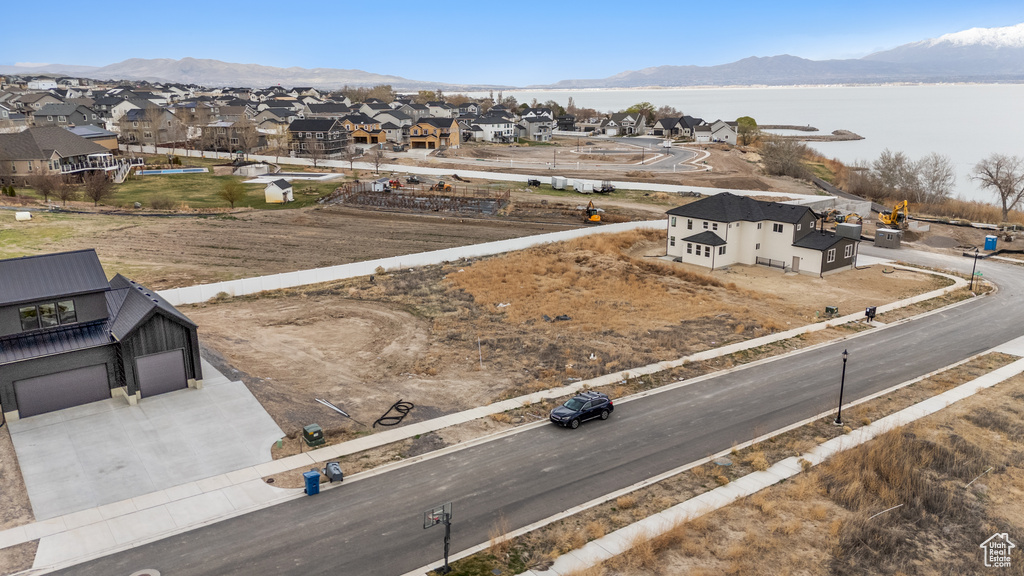 Aerial perspective of suburban area featuring a water and mountain view