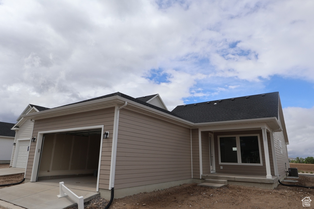 Ranch-style house with an attached garage and driveway