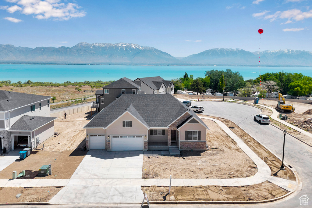View from above of property featuring a water and mountain view