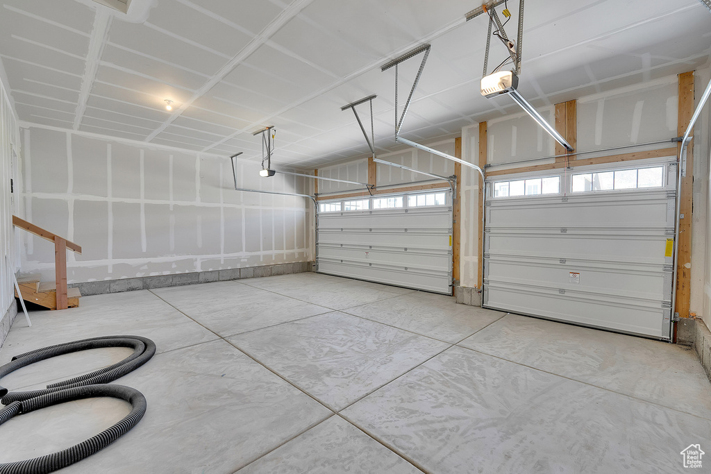 Garage featuring a garage door opener