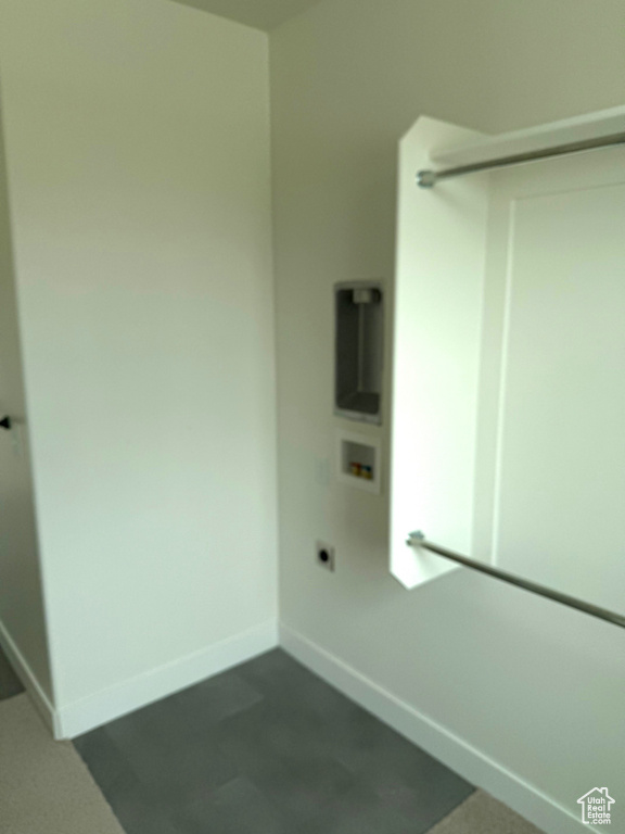 Clothes washing area with baseboards, washer hookup, laundry area, and electric dryer hookup